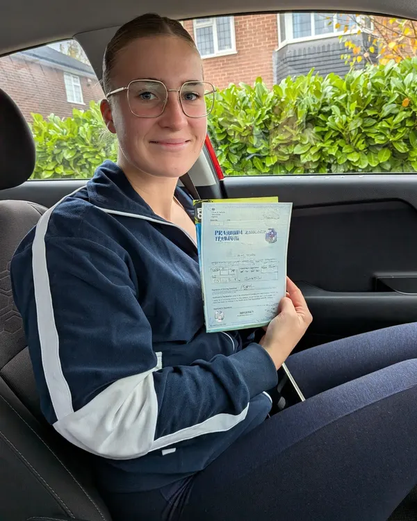 Learner celebrating passing their driving test first time